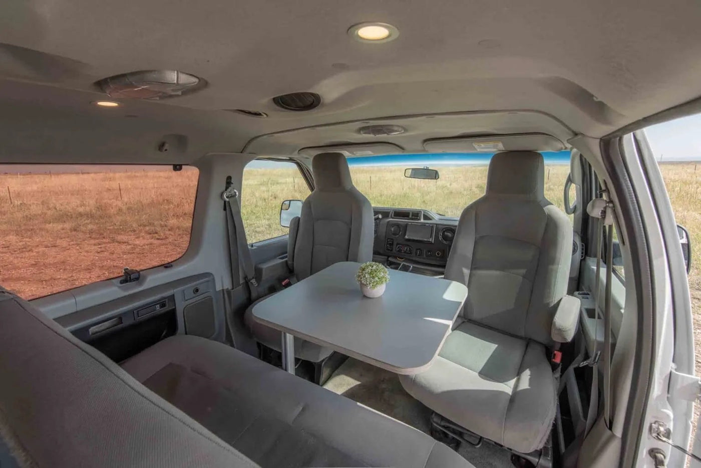 and scenic views from the open back door.|Inside an rv rental van conversion — photo 13