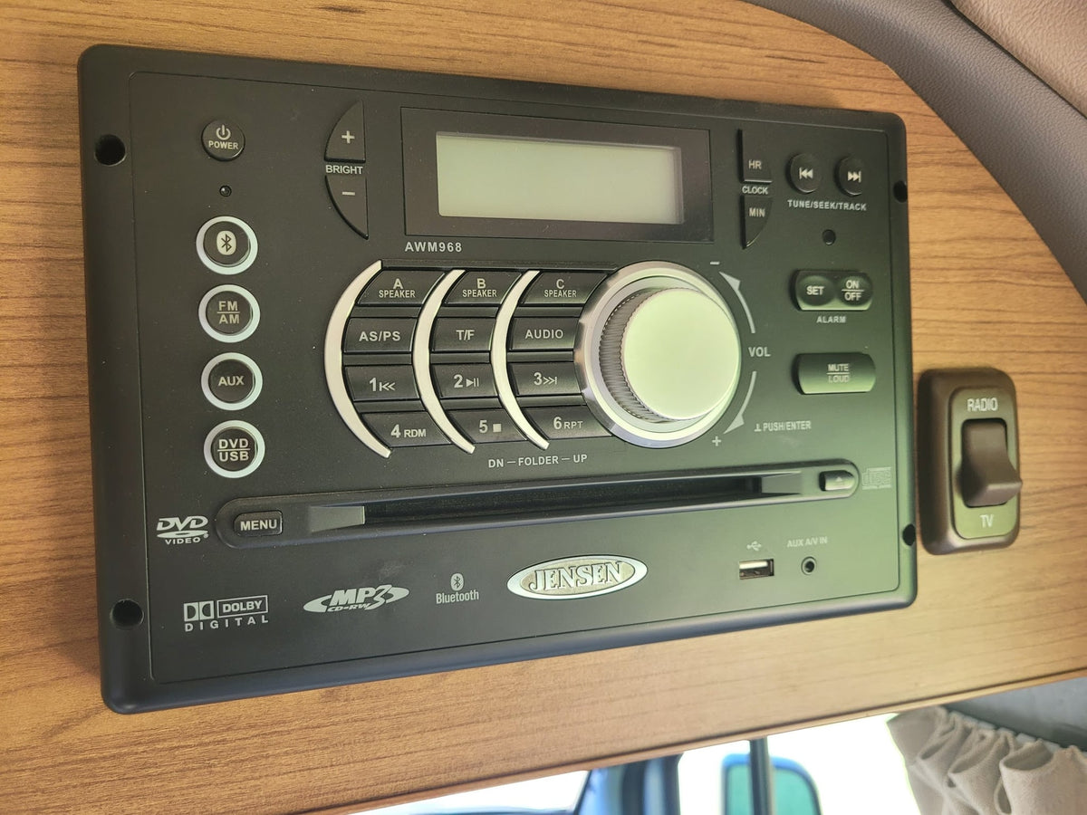 and a clear view into the cockpit.|RV rental interior featuring wooden cabinets — photo 20