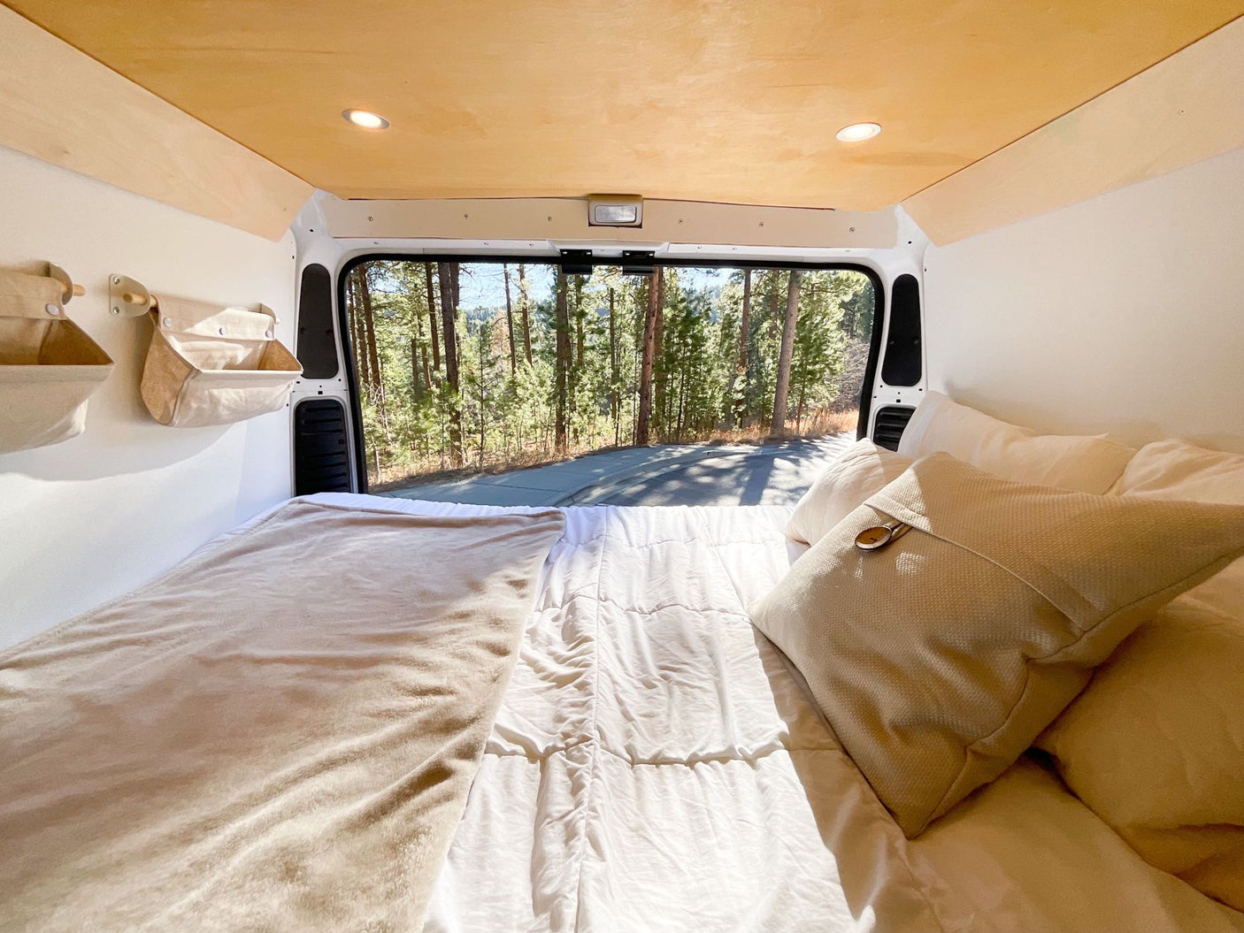 a compact camper kitchen with wooden counters