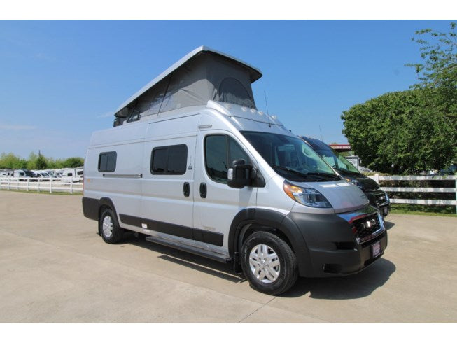Silver pop-top camper van