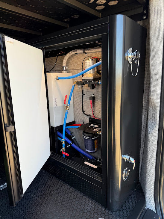 RV rental's integrated water system: pump, filter, and tank with plumbing. Essential utility for camper comfort.