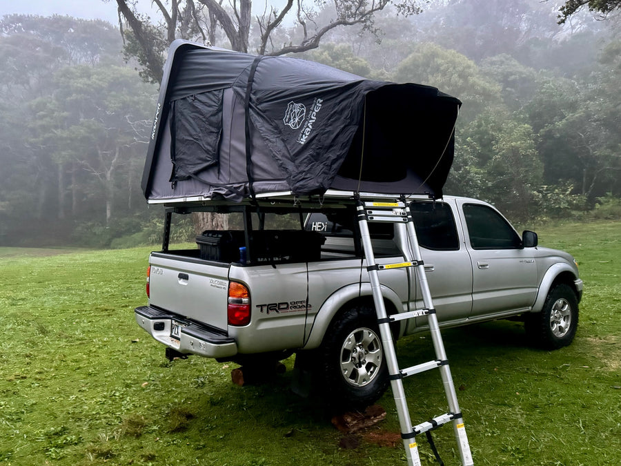 Silver truck with an iKamper rooftop tent deployed