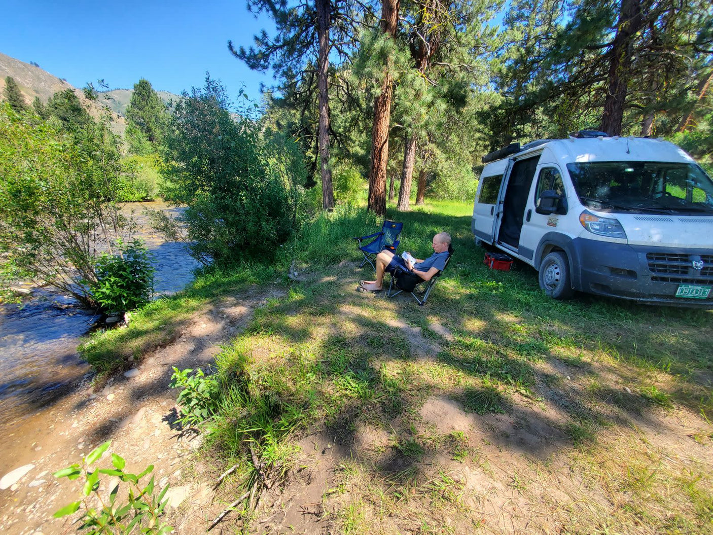 and comfortable seating.|RV rental interior: Elevated bed with ladder