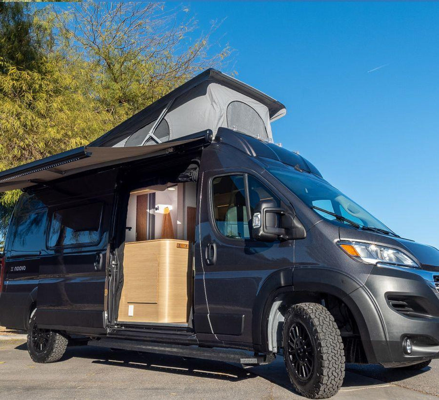 Modern dark gray camper van with pop-top roof