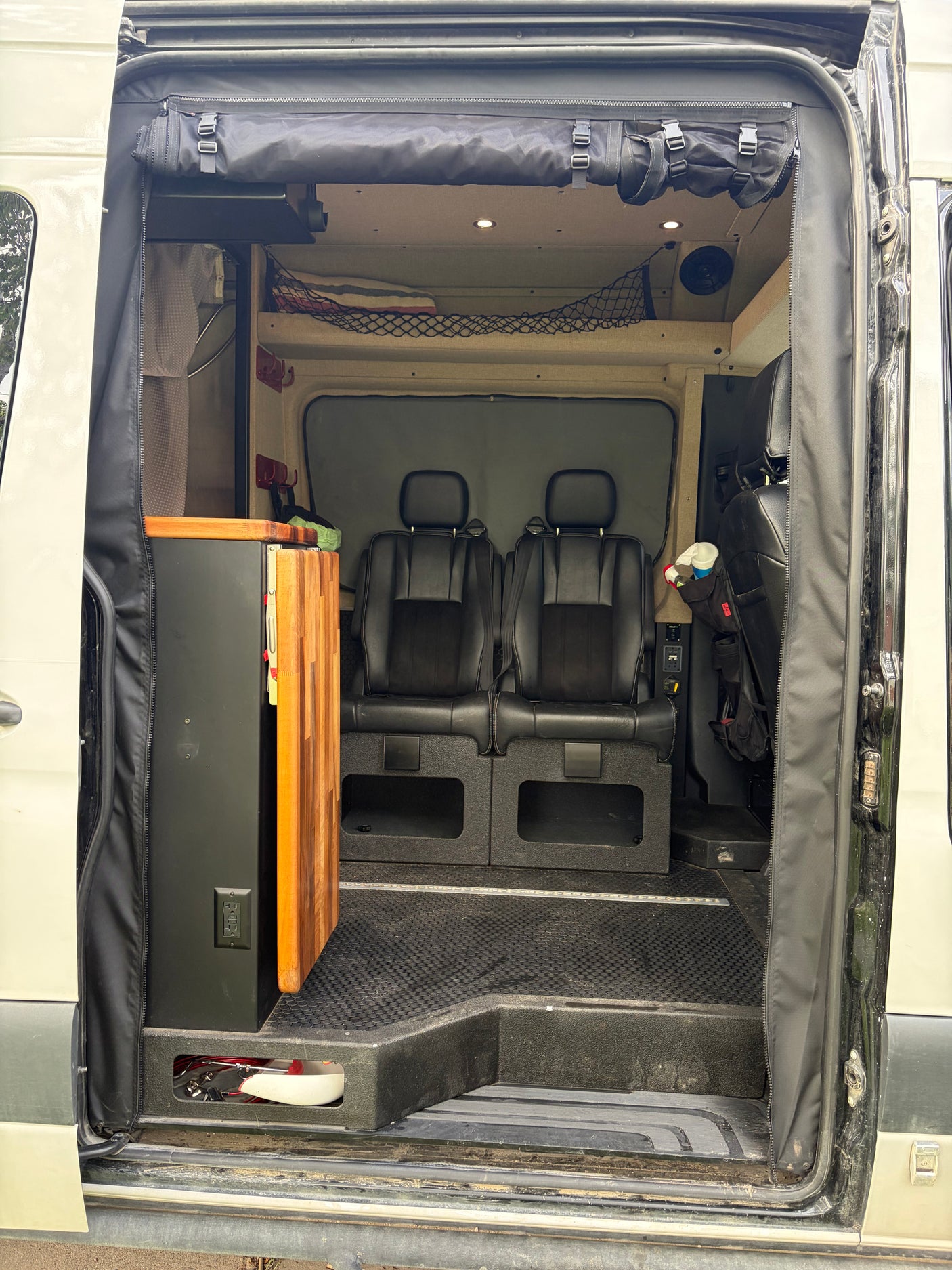 Inside an rv rental camper van: comfortable seating, compact kitchenette, and smart storage solutions for mobile adventures.