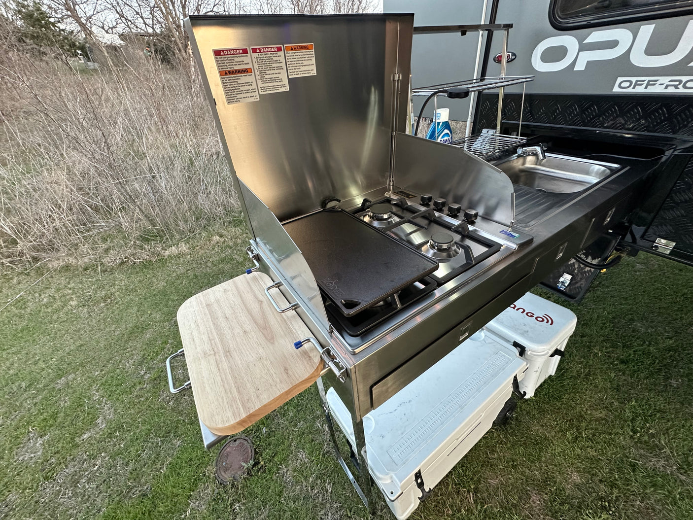 featuring an outdoor kitchen