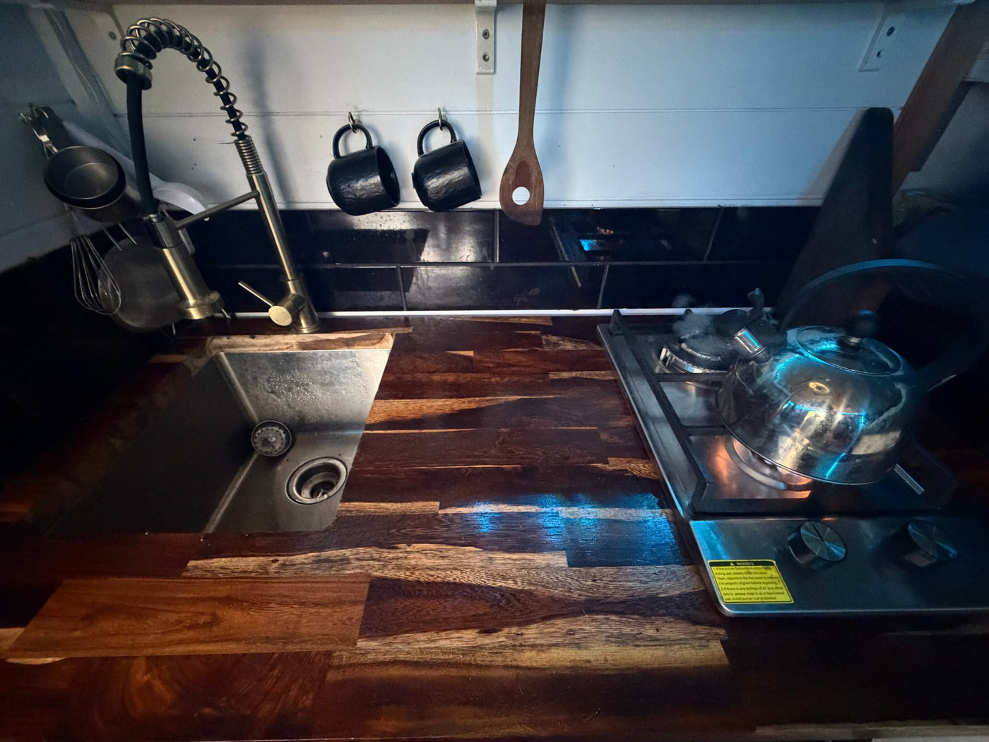 and a black geometric rug.|White Ford F-350 truck with a custom black overland truck camper — photo 6