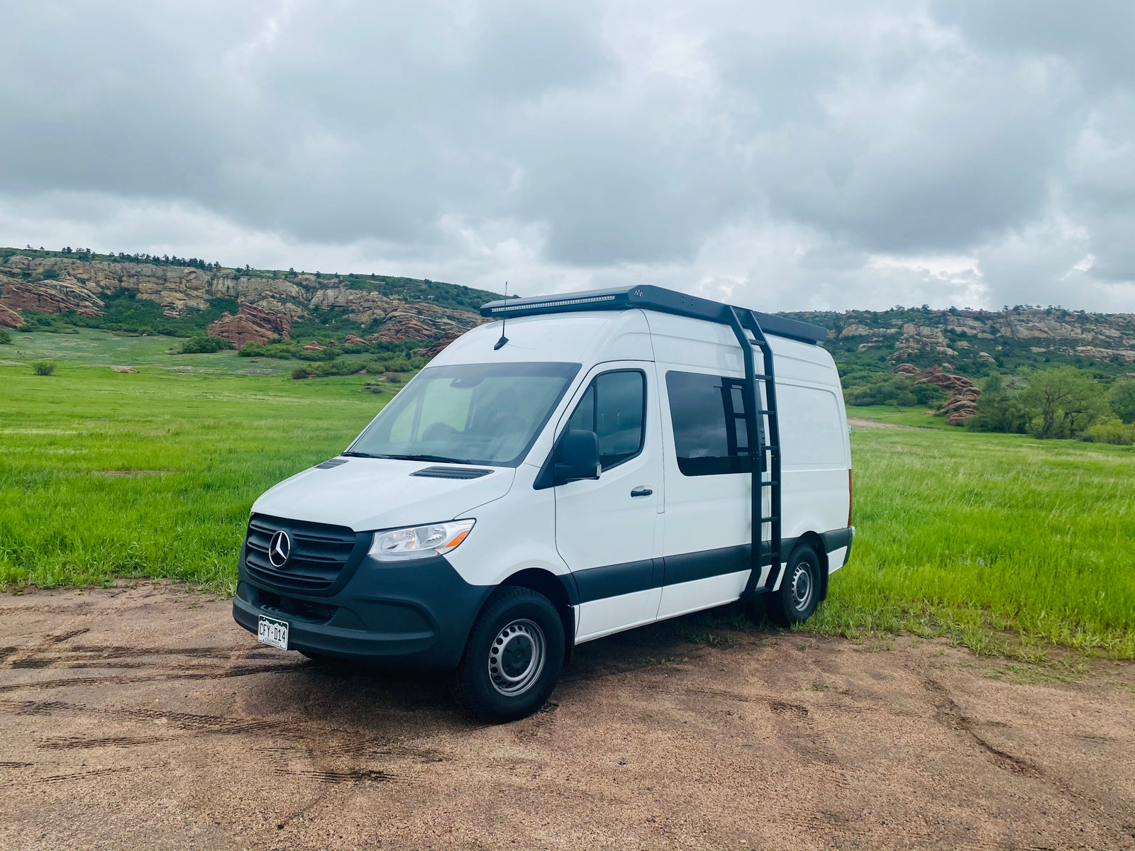 Explore Colorado with this white Mercedes Sprinter camper van, ideal for your next rv rental adventure.