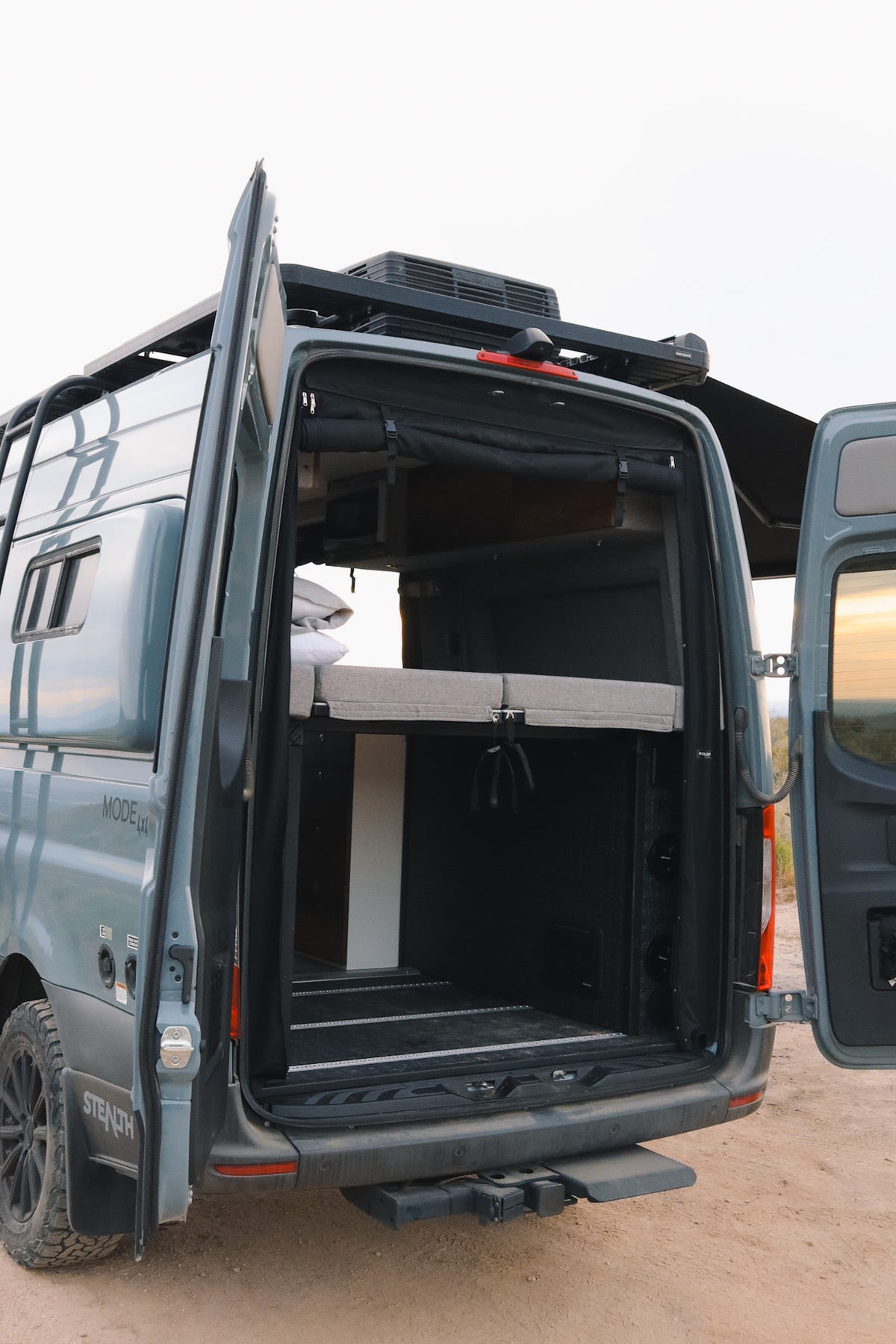 with a Storyteller Overland control panel above. Ready for your adventure food & drinks.|RV rental's compact sink and faucet unit — photo 9