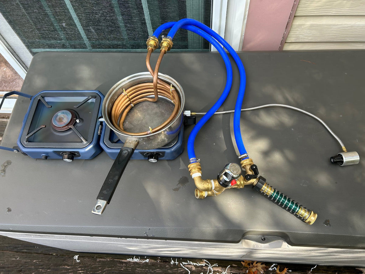 likely for an RV rental or camping trip.|RV rental setup: a compact portable water system with pump — photo 4