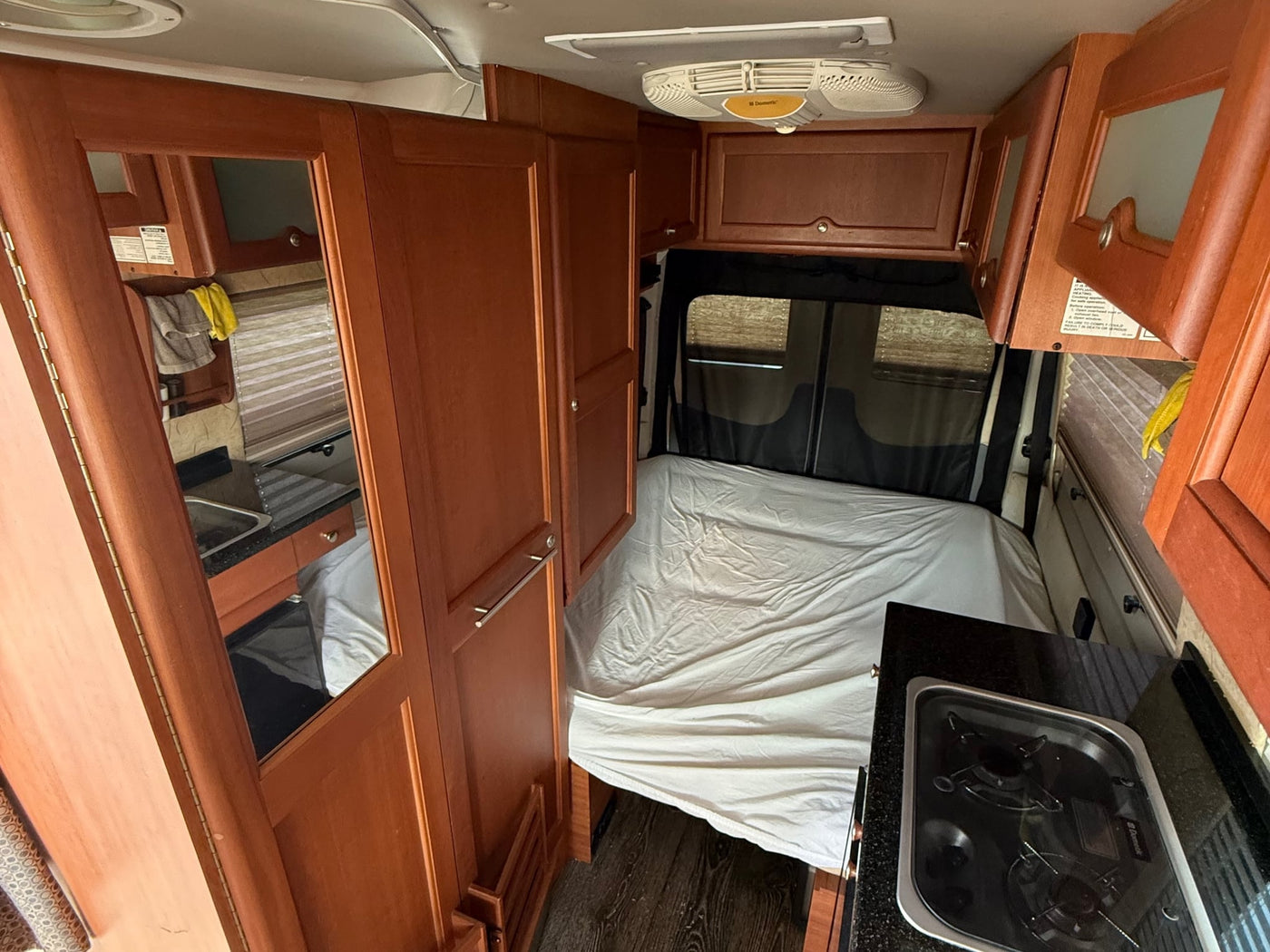 and the driver's seat. Ready for adventures!|RV rental camper van interior showing the driver's cockpit — photo 14