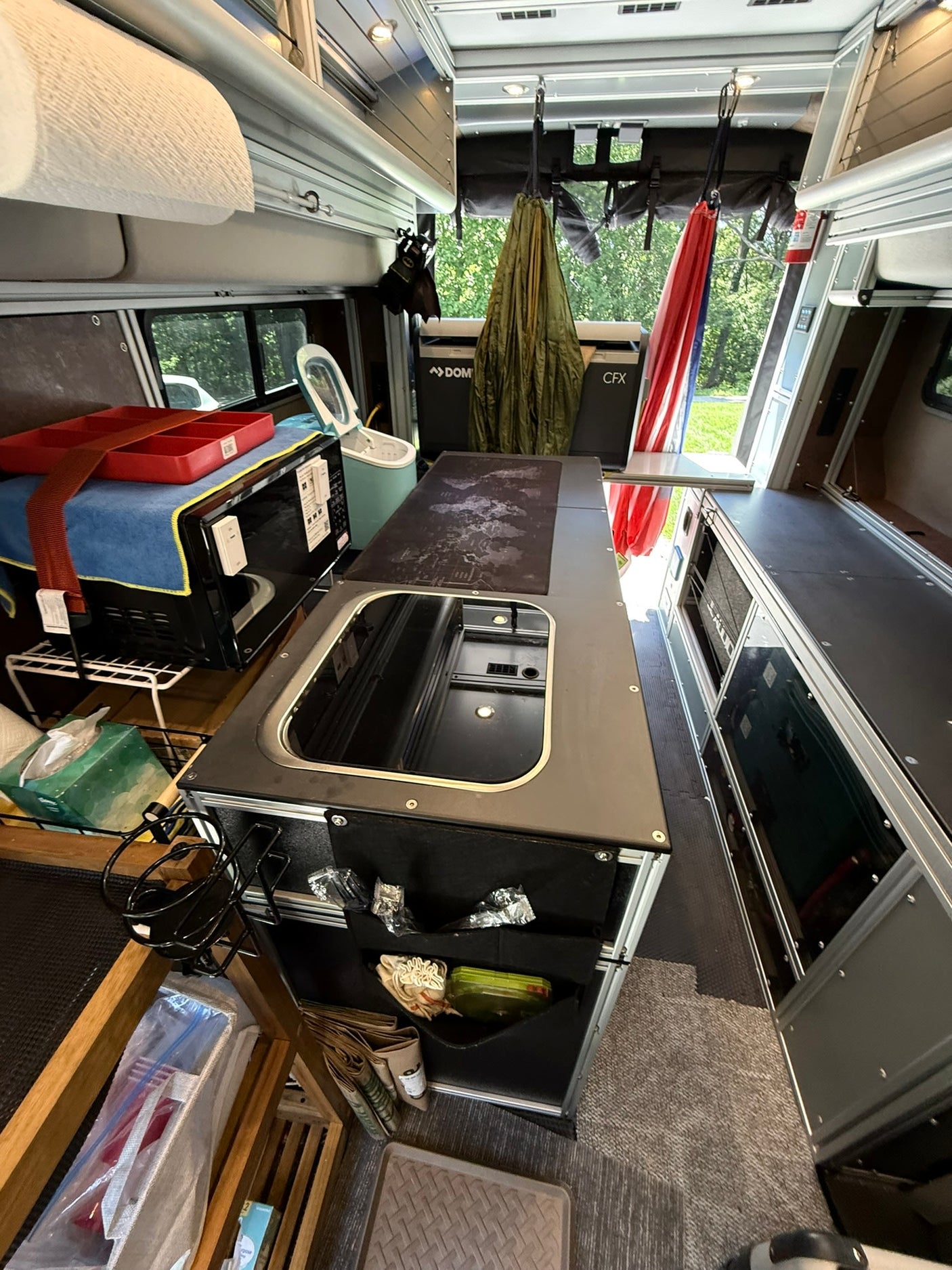 next to a house and green lawn under a blue sky.|Spacious rv rental interior