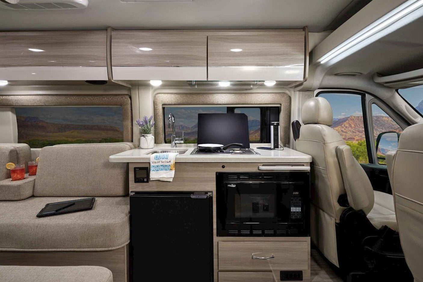 Bright RV rental interior: kitchen with stove/sink