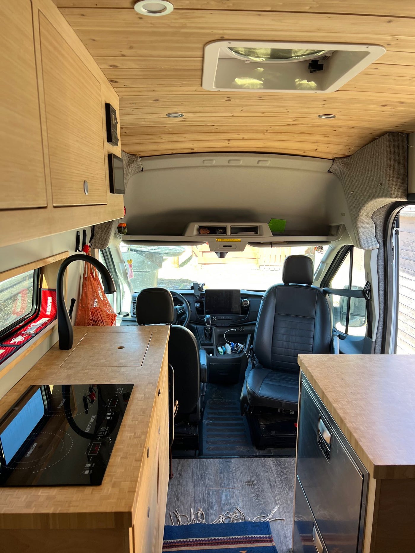 ready for adventure.|Inviting rv rental van interior with a cozy bed — photo 4