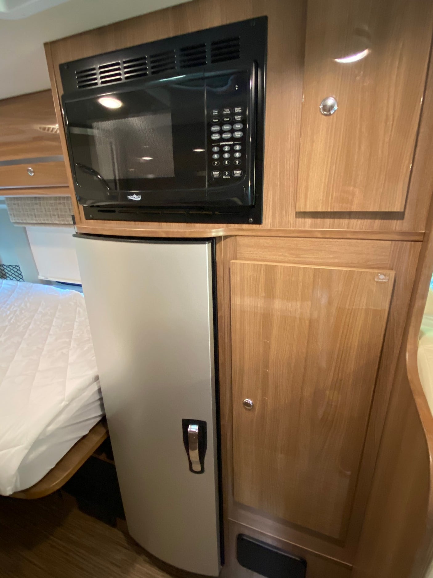 and ceiling AC. Ready for travel!|Inside a modern RV rental: dining table