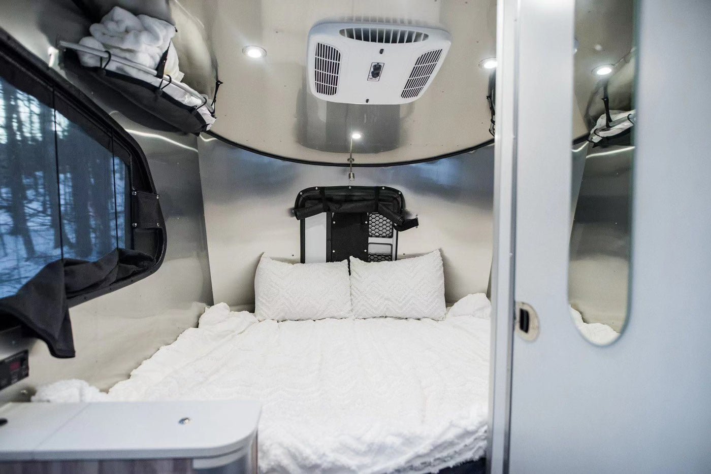 and a small dog. A bridge is in the background.|RV rental kitchen: Dometic fridge — photo 4