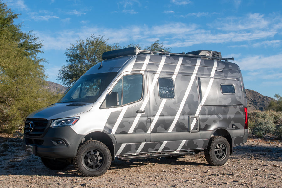 Adventure-ready Mercedes Sprinter van in a unique camo wrap, perfect for an RV rental escape.