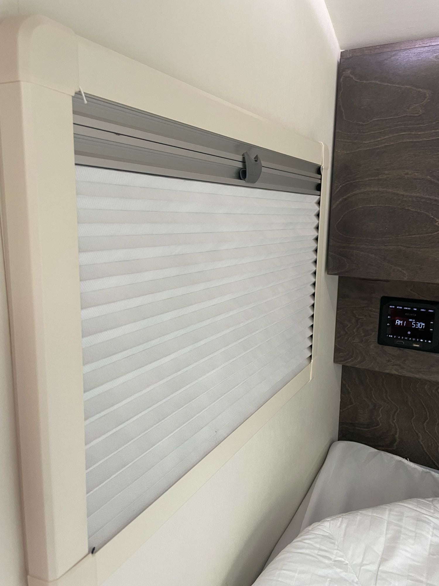 compact rv rental interior featuring a large bed