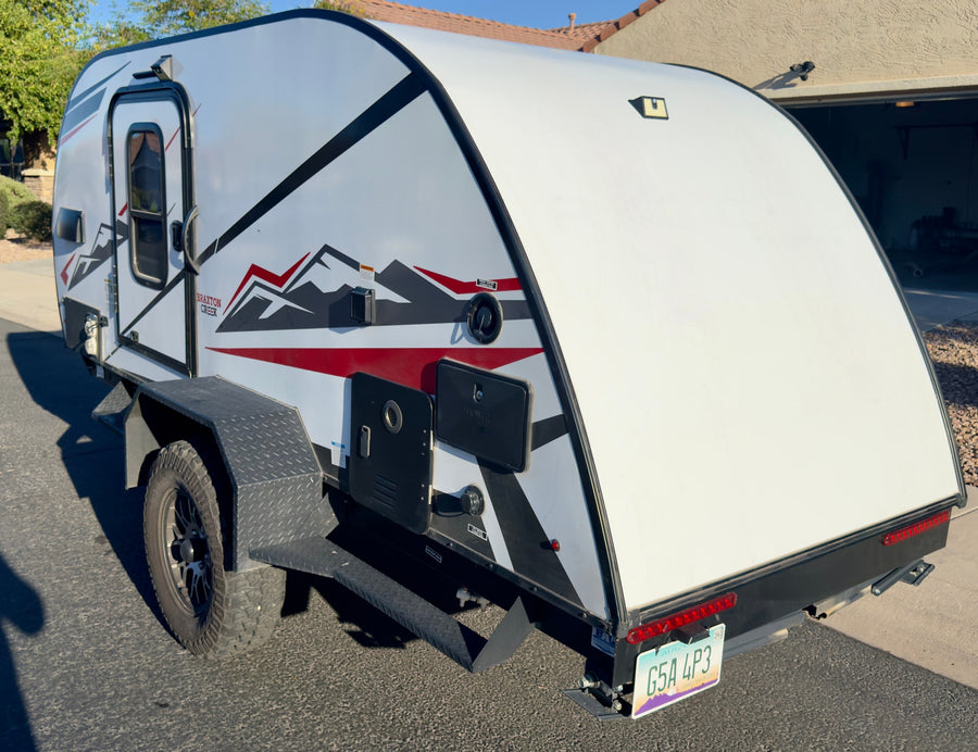 featuring off-road tires and black/red graphics
