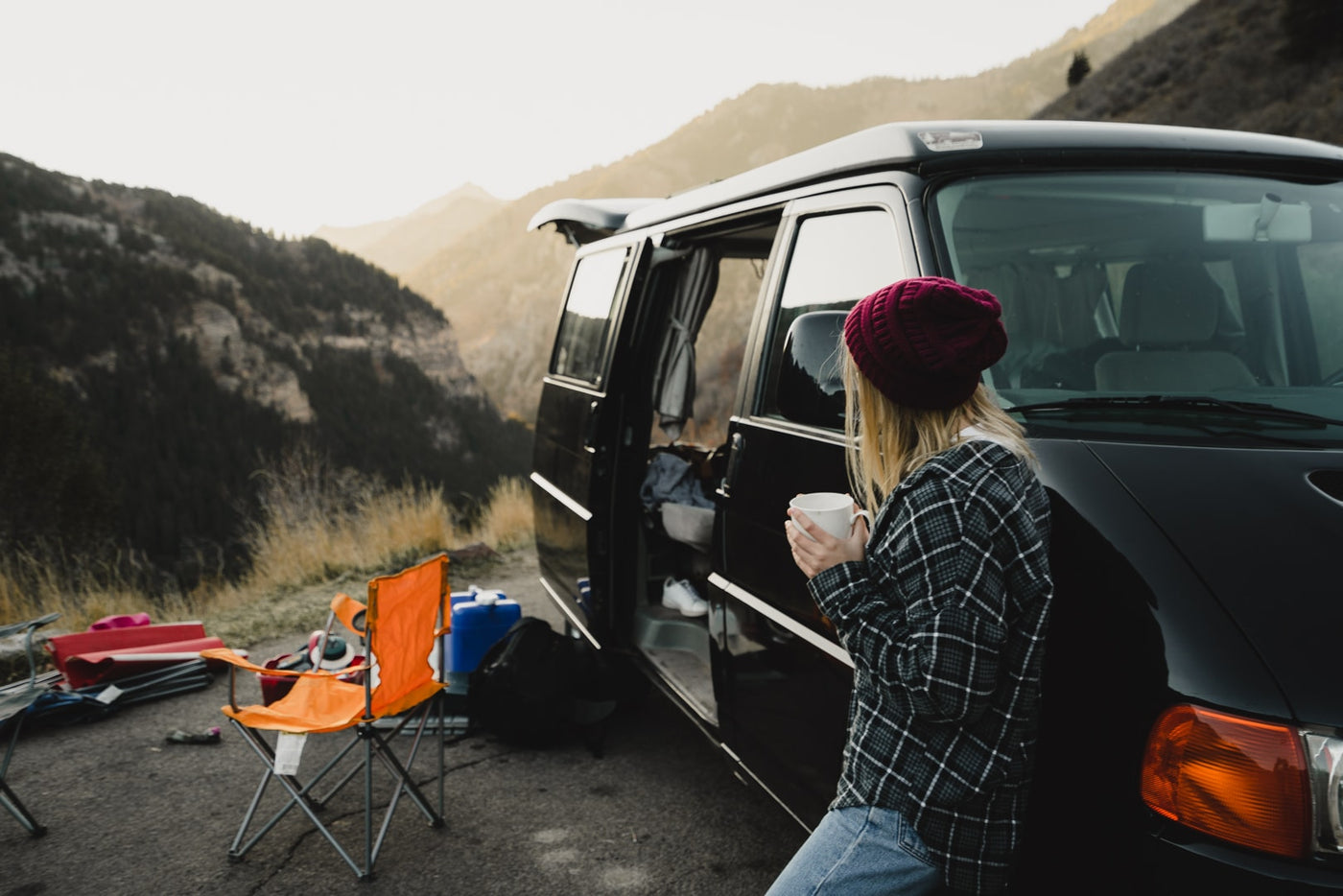 light-colored captain's chairs. Ideal for passenger comfort.|RV rental interior: rear seats fold flat — photo 6