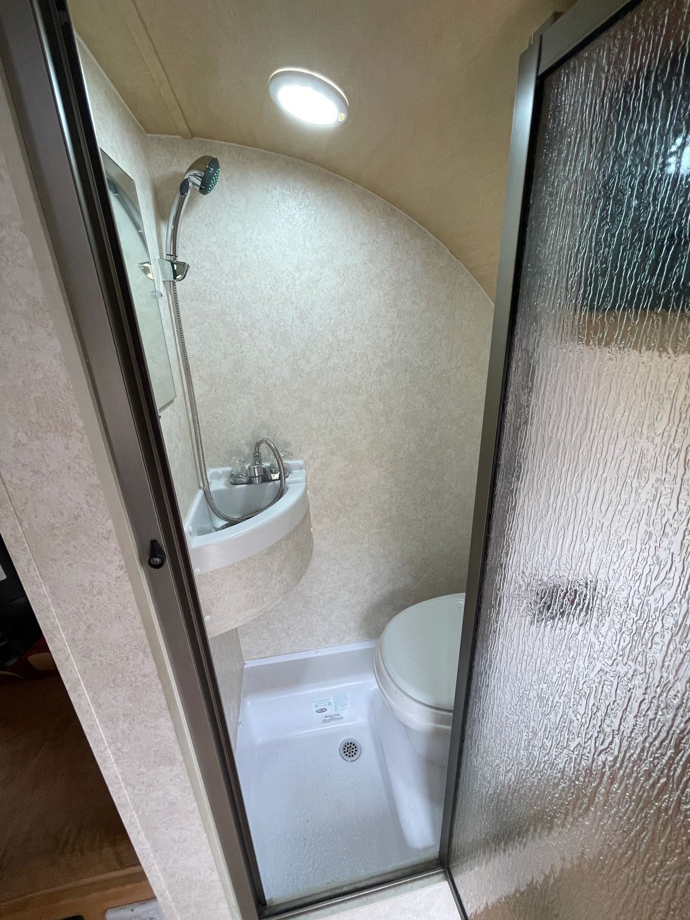 and cooler for travel.|Inside an RV rental showing a light wood dinette