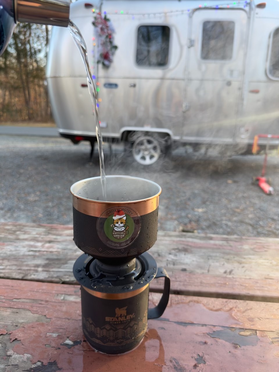 assisting with trailer hitching in an RV.|Fully equipped RV rental kitchenette: sink