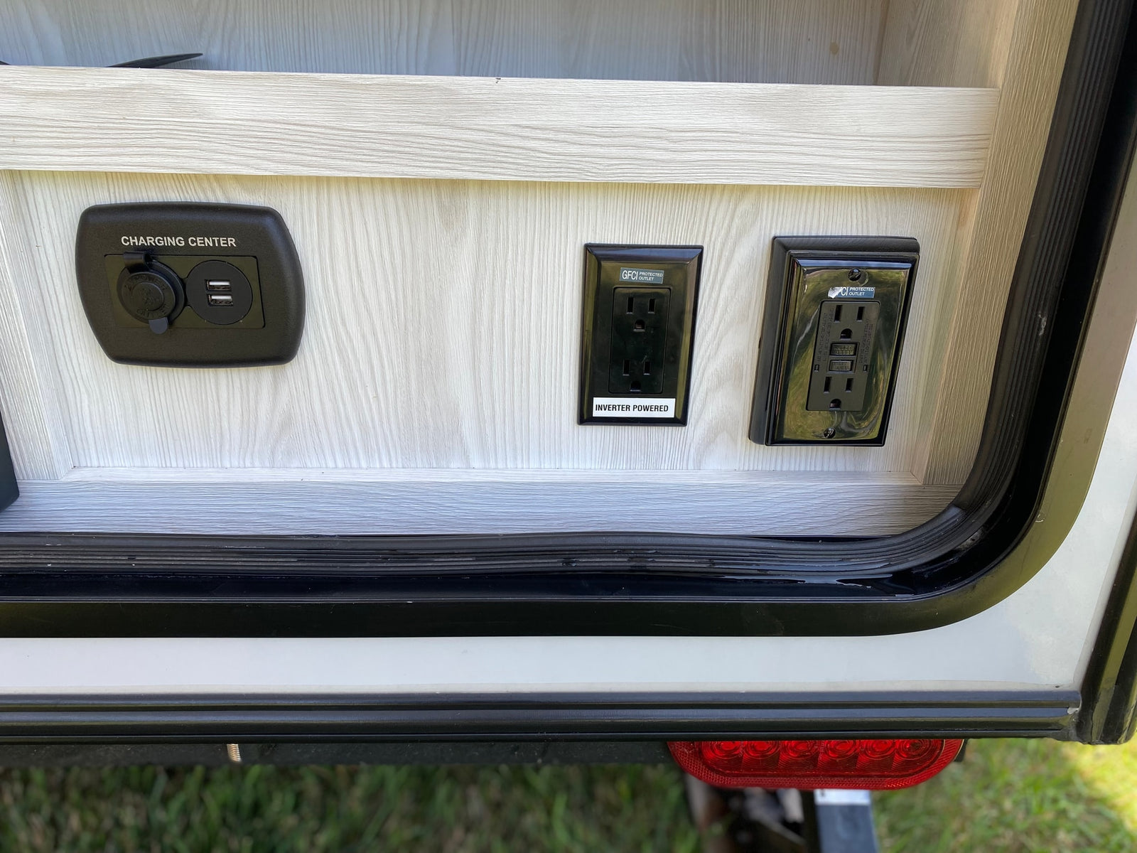 An rv rental charging station with USB/12V ports and GFCI inverter-powered outlets for convenient power.