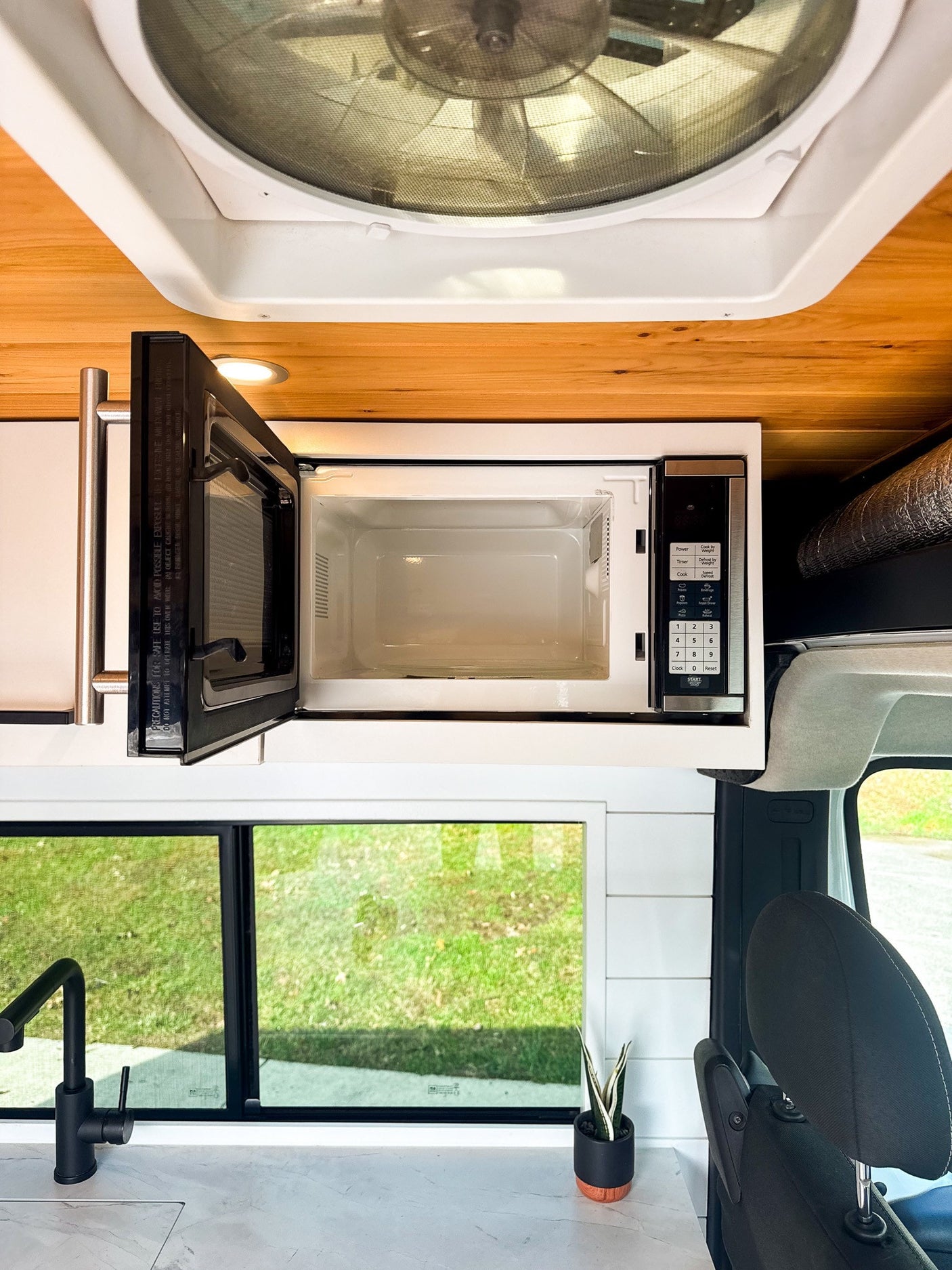 and marble-look countertop.|Interior of an RV rental