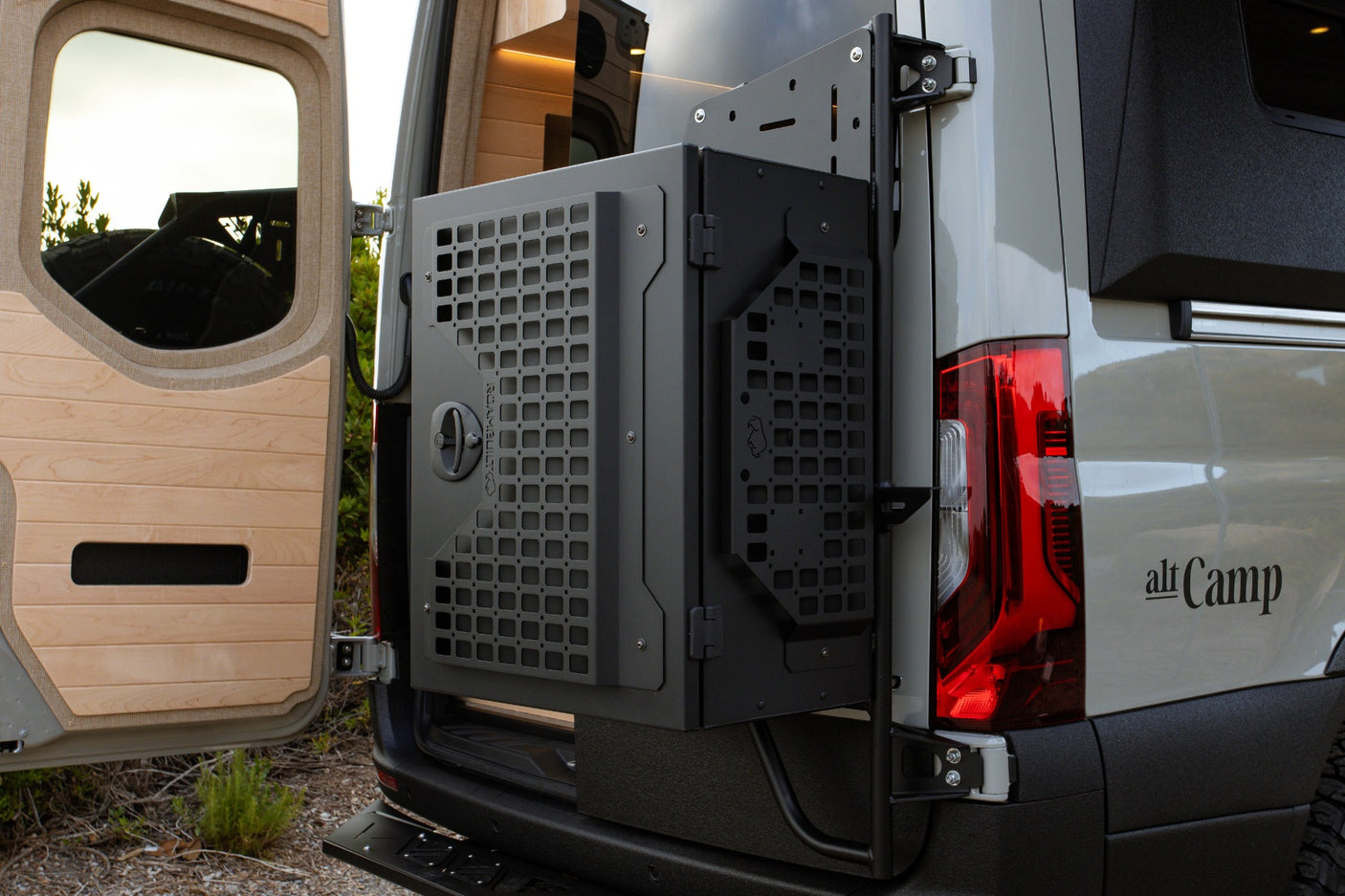Rear of an alt Camp camper van, featuring a large external gear storage box. Perfect for your RV rental adventure.