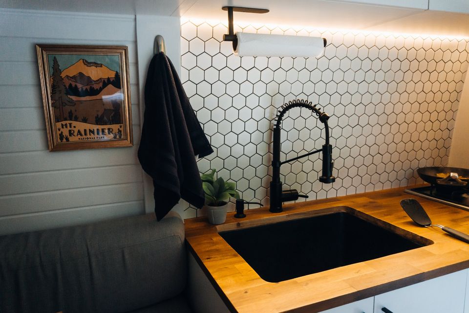 ready for adventure.|RV rental: Inside a custom camper van with a dinette