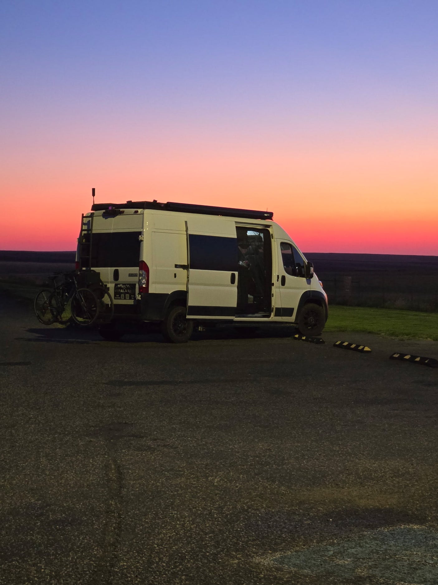 White RV rental van with bikes