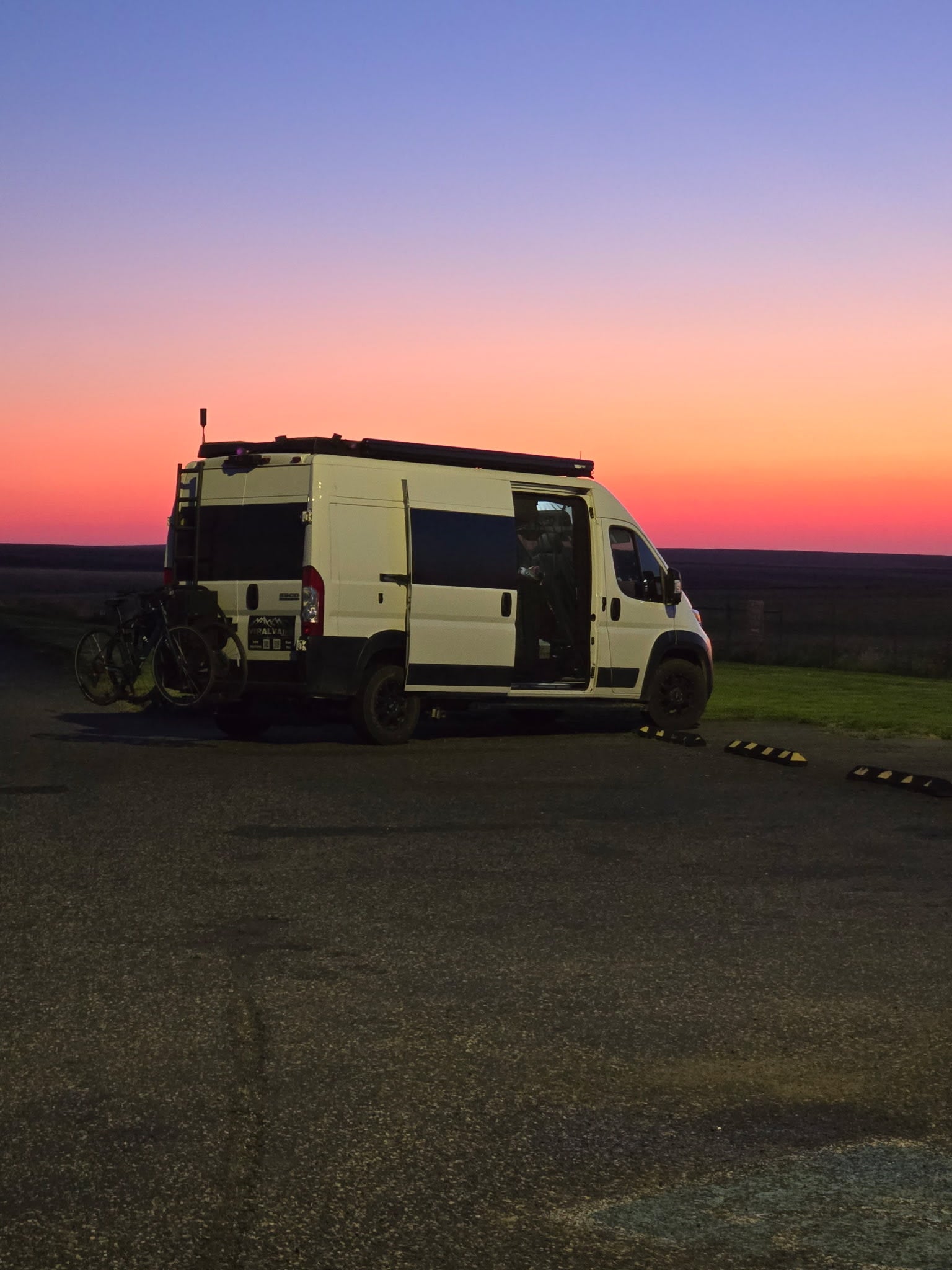 White RV rental van with bikes