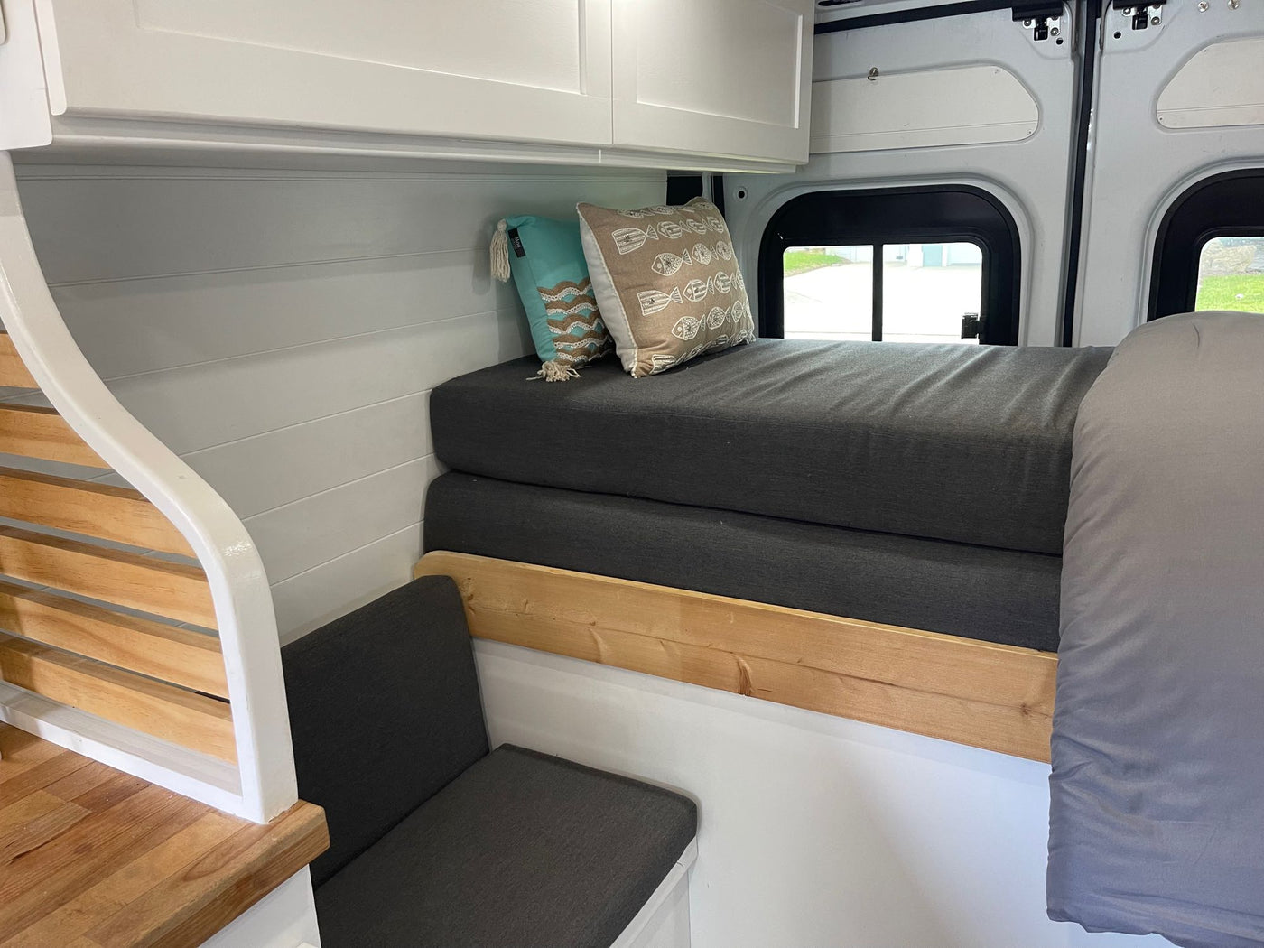 and comfy bed.|Cozy rv rental interior showcasing a compact kitchen — photo 7