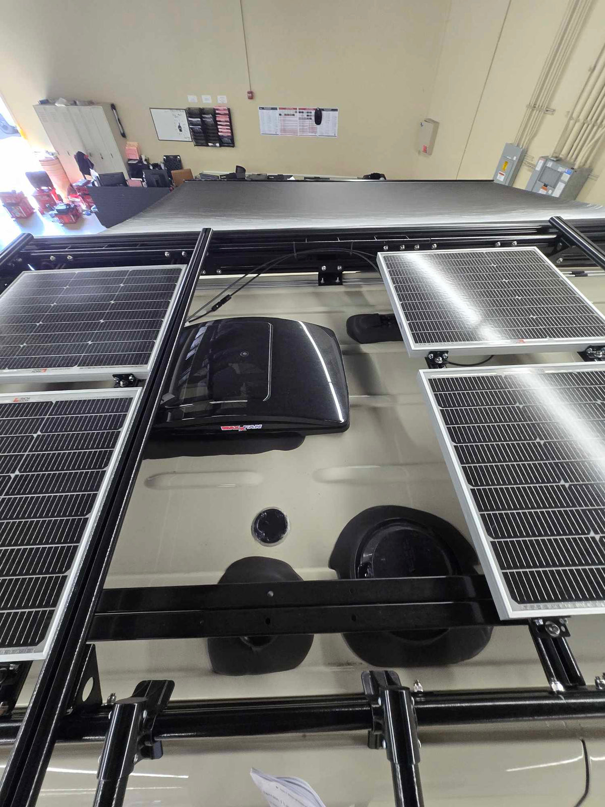 and overhead storage bin.|RV rental interior showcasing a compact kitchen — photo 17
