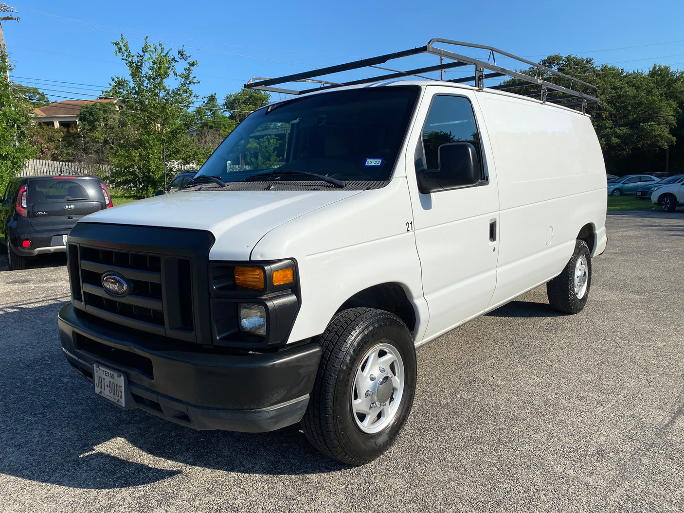 including a distinctive pop-top camper.|Inside an RV rental van: front cabin showing driver's area