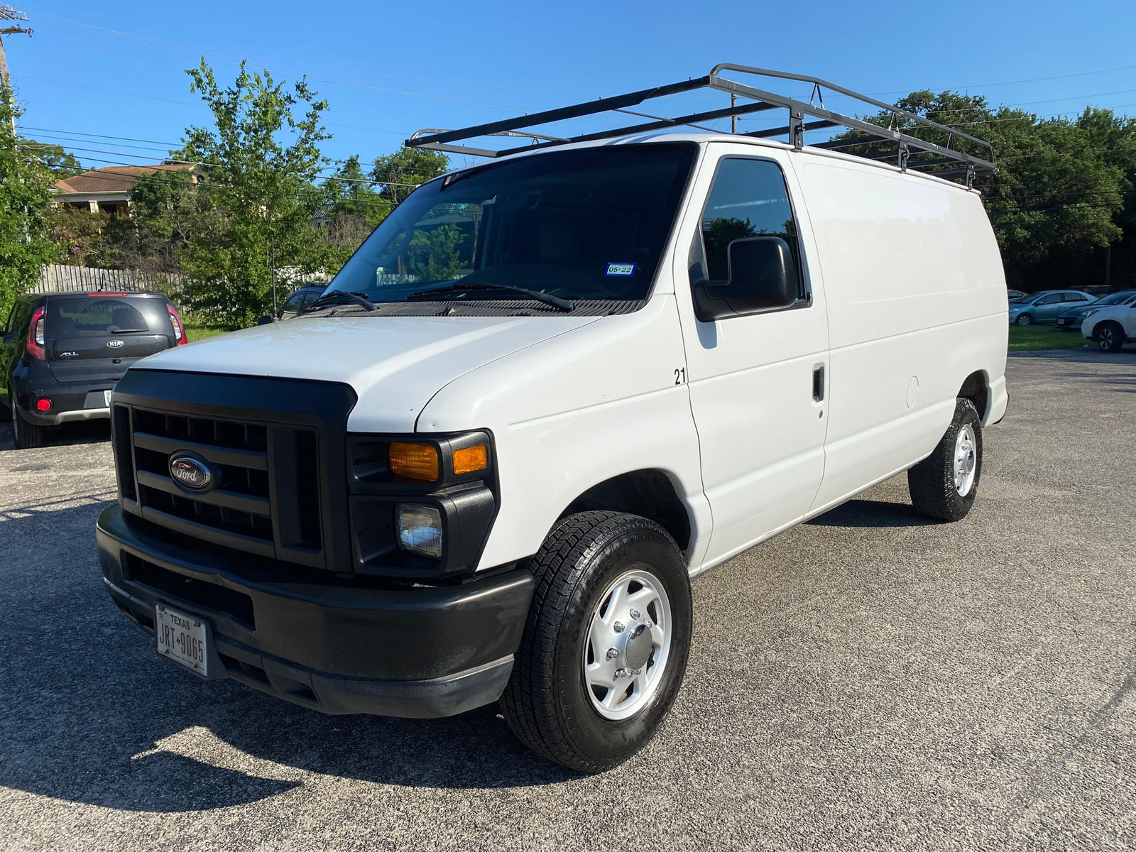 including a distinctive pop-top camper.|Inside an RV rental van: front cabin showing driver's area