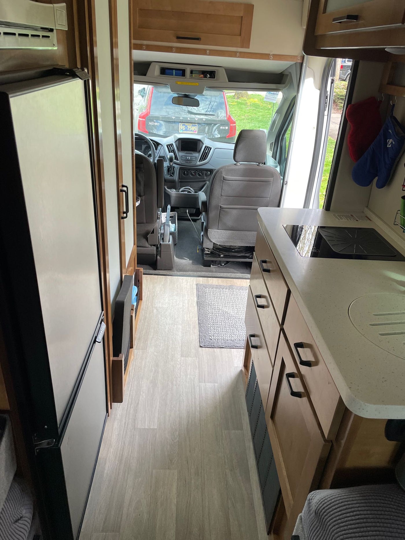 and a comfortable bed.|Cozy RV rental interior with bed — photo 11