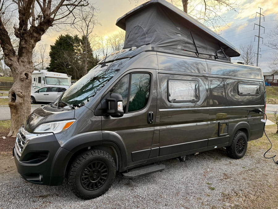 Experience van life travel with this sleek dark grey camper van