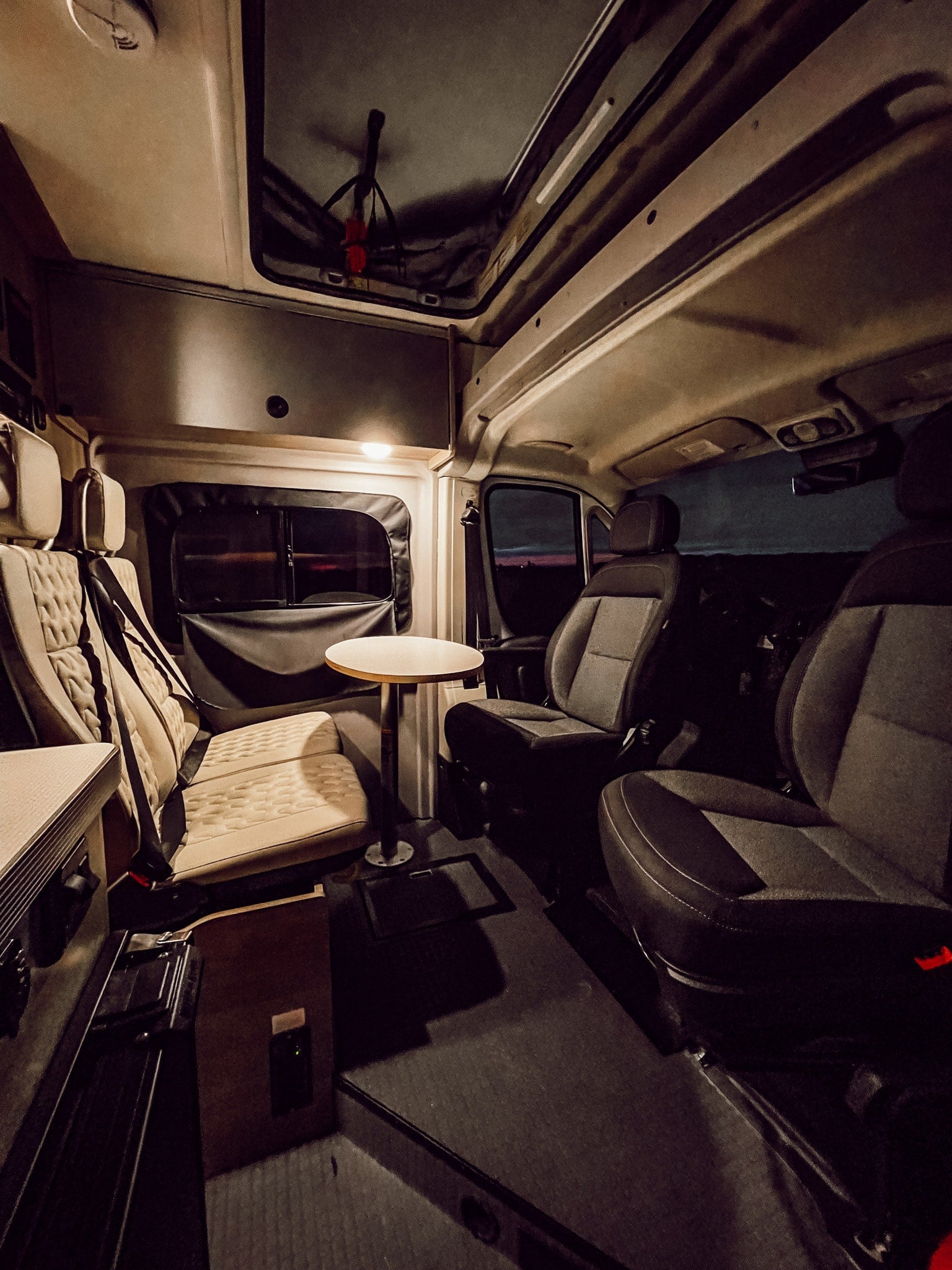 and control panels for an equipped road trip.|This **RV rental** features a functional **camper van kitchen** with a two-burner stove
