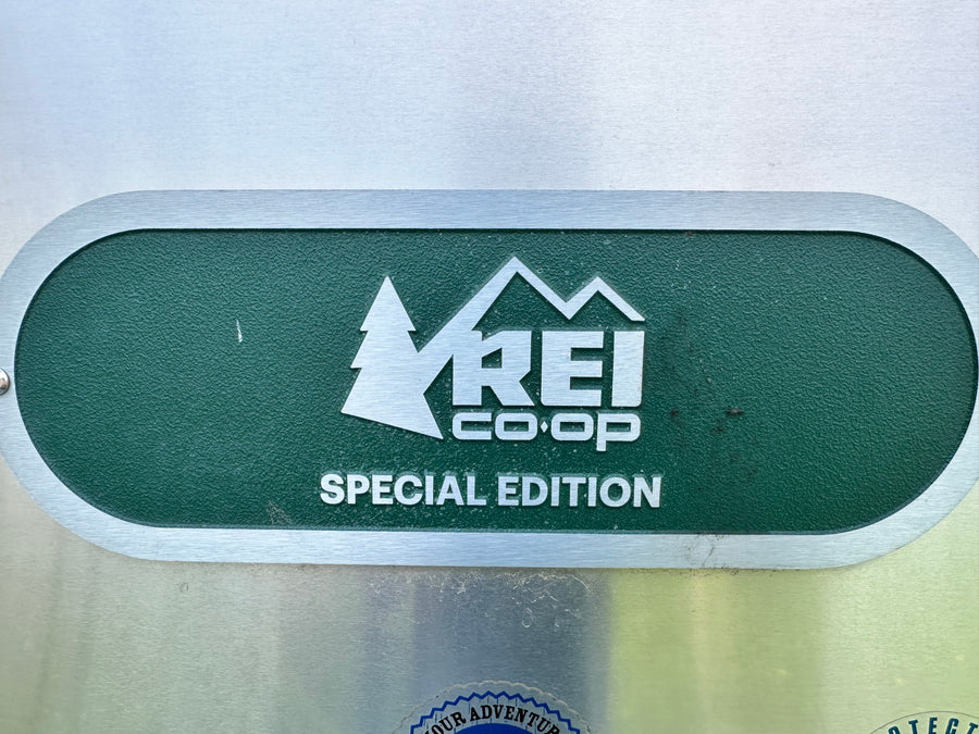 REI Co-op Special Edition emblem on a metallic surface, likely for an RV rental. Ready for your next outdoor adventure.