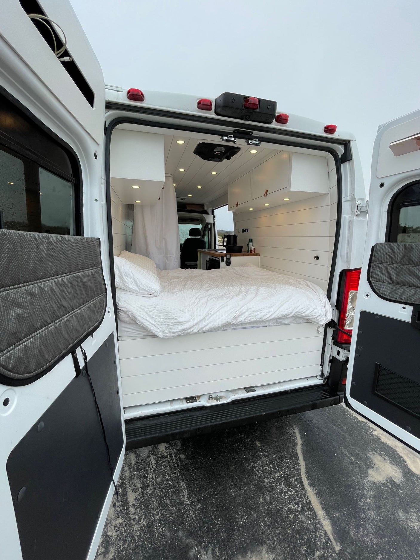 and plumbing for a compact water system.|RV rental interior: practical kitchen with sink