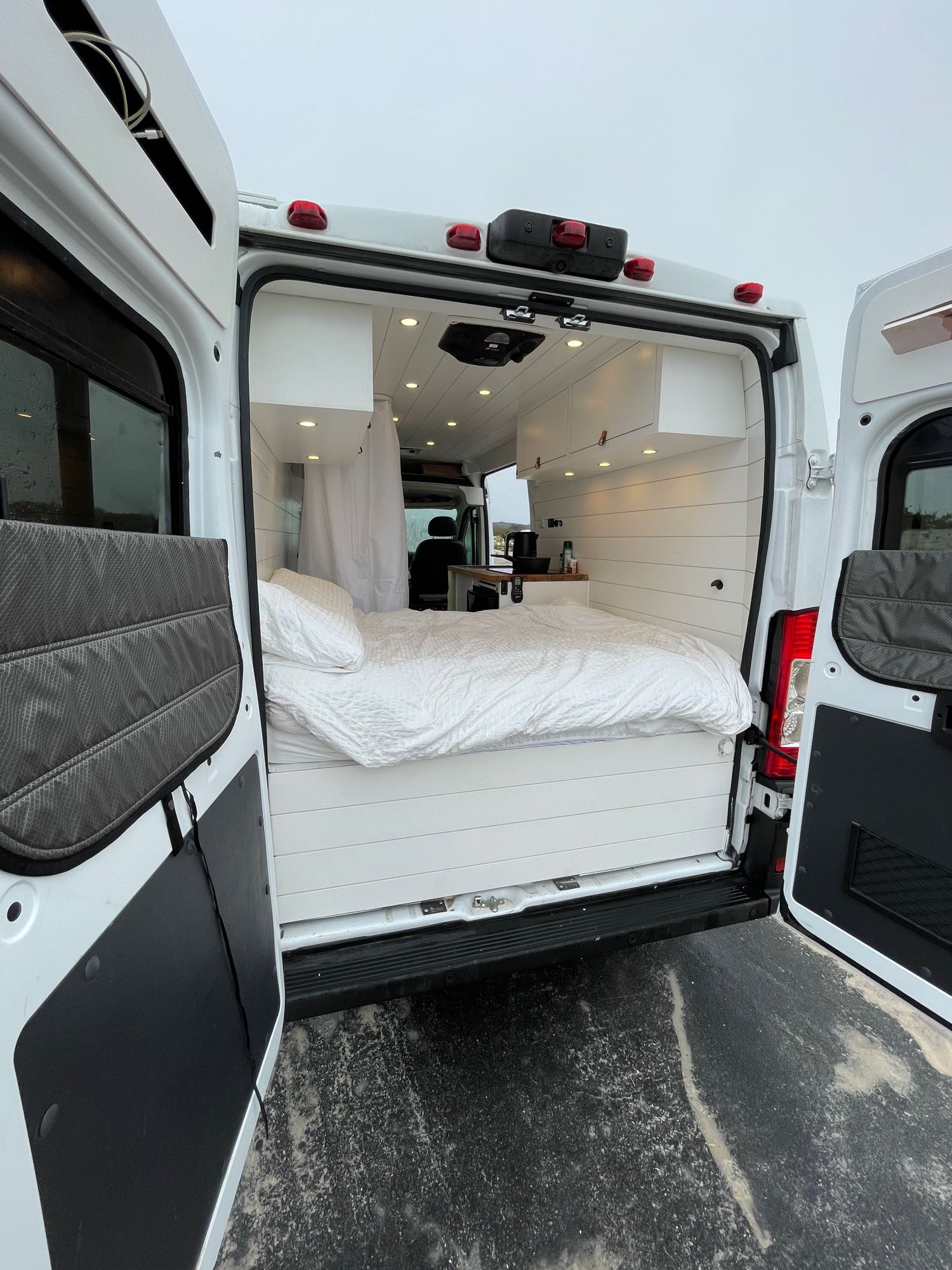 and plumbing for a compact water system.|RV rental interior: practical kitchen with sink