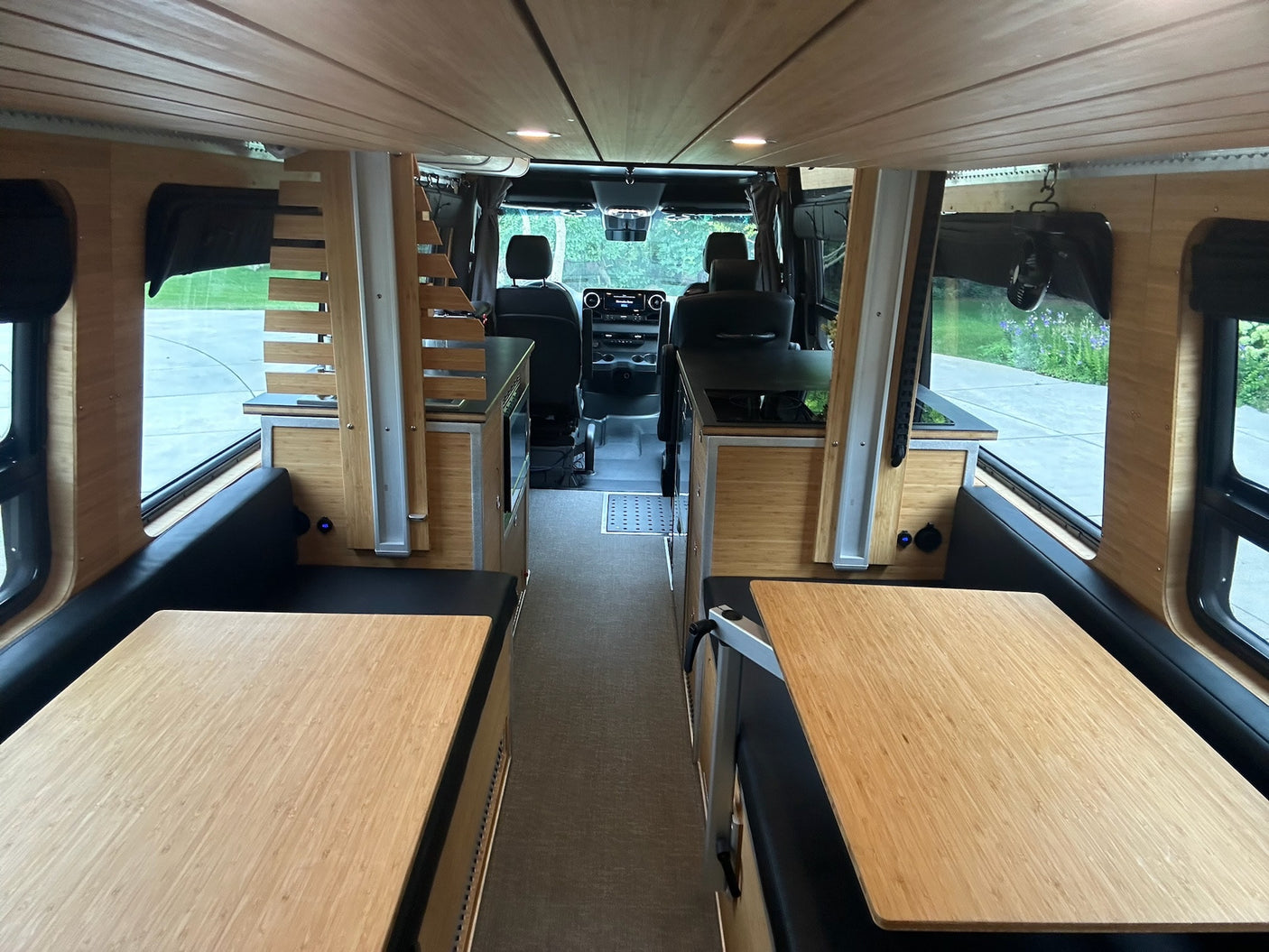 and an overhead bed.|Modern rv rental interior: kitchenette with sink
