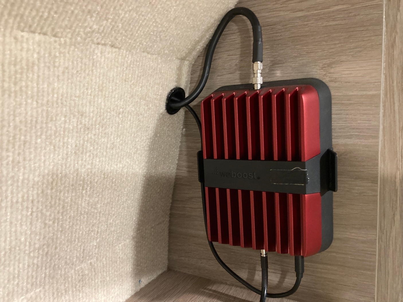 A weBoost cell signal booster installed in an rv rental, improving connectivity on the go.