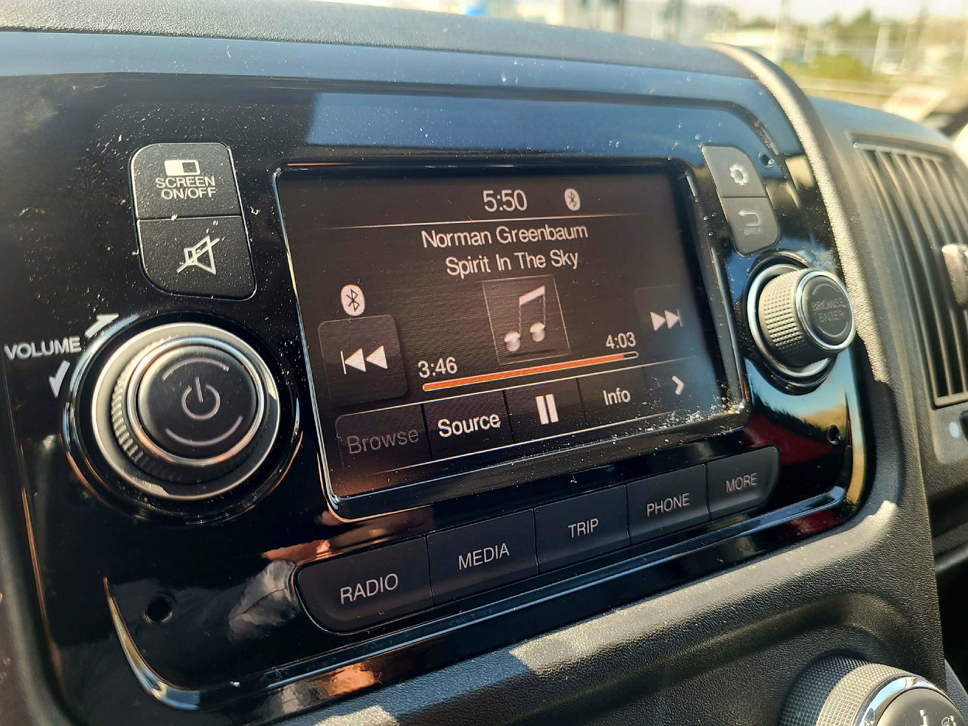 RV rental: Dashboard infotainment system playing "Spirit In The Sky." Volume, screen, media controls visible for easy navigation.