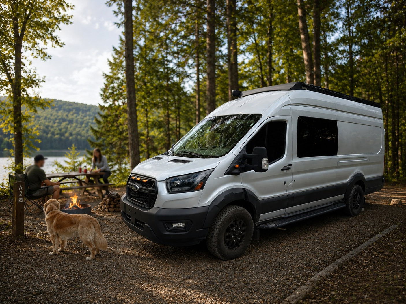 with a glowing campfire.|Explore nature with an RV rental! Silver camper van