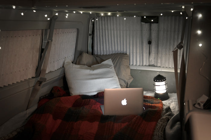 illuminated by a lantern and warm string lights