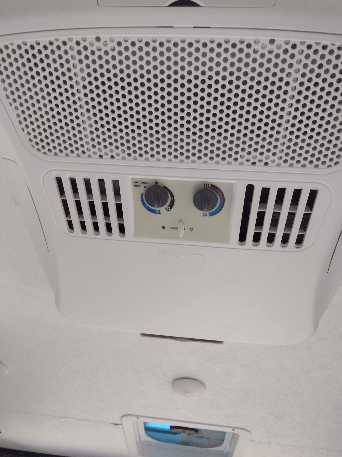 RV rental climate control unit: A Dometic air conditioner and heater with adjustable settings visible on the ceiling.