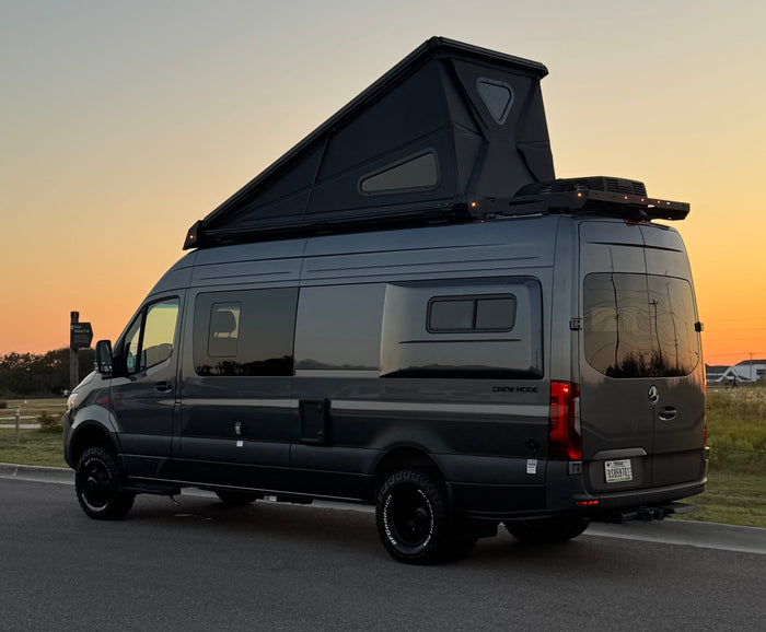 ideal for an rv rental adventure under a sunset sky.|Adventure-ready Mercedes Sprinter camper van by Storyteller Overland with pop-top