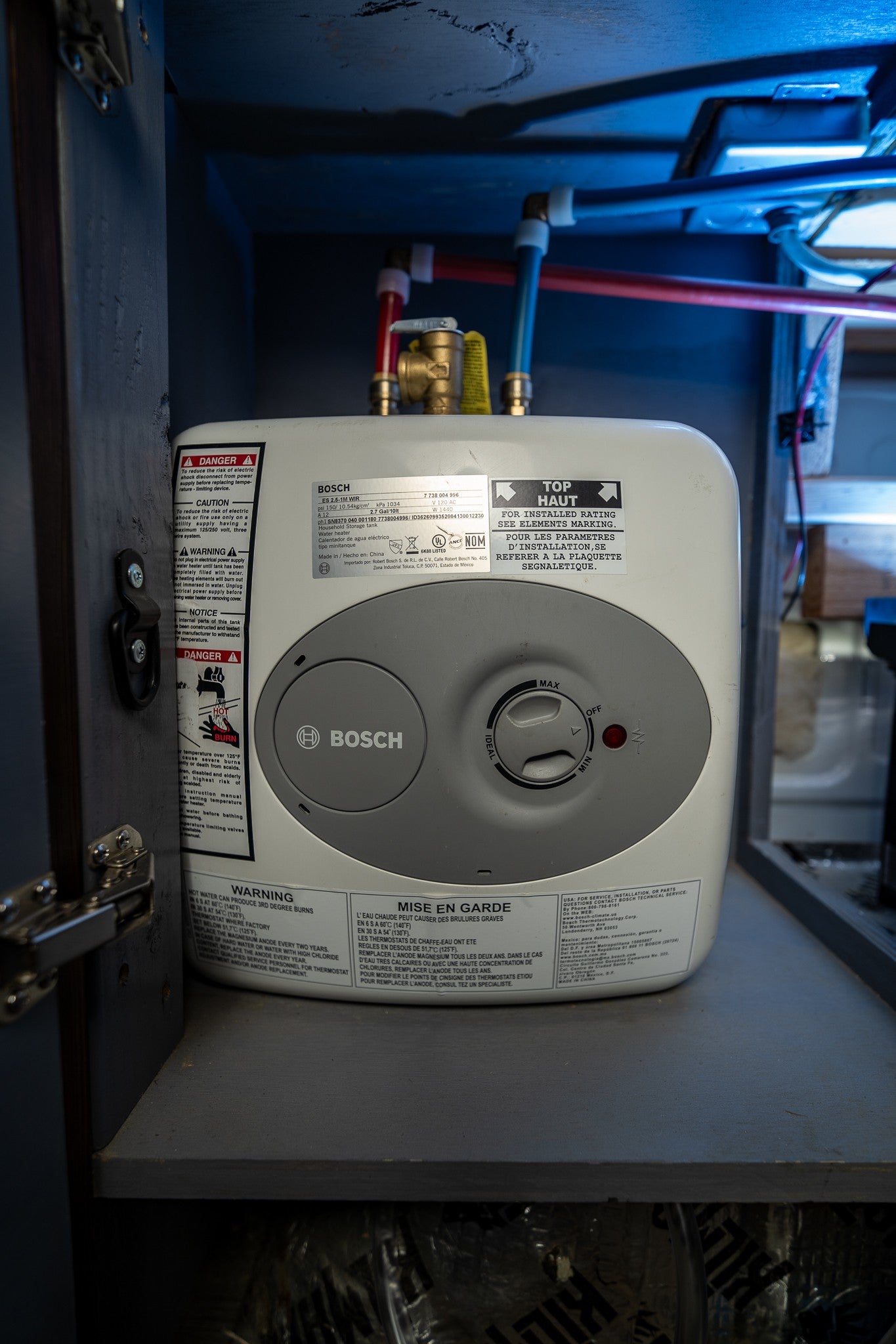 Bosch mini-tank water heater in an RV rental provides compact hot water. Ideal for small spaces on the go.